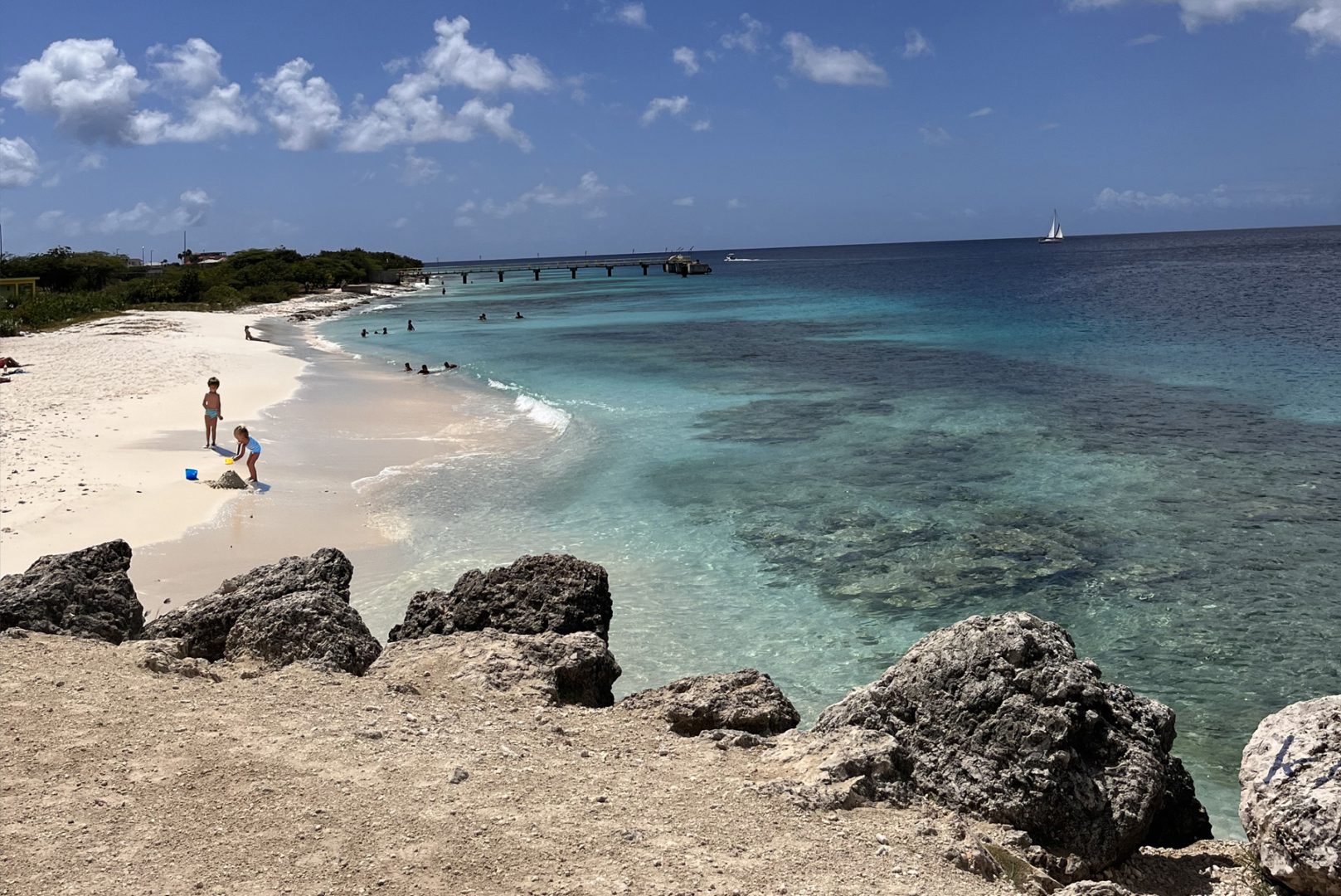 Family activity relaxing on beach on Bonaire