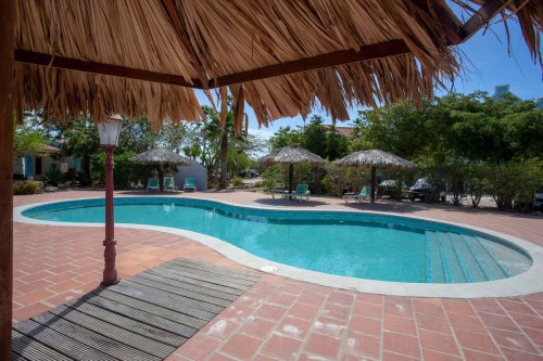 Caribbean Court Aqua Marina with a refreshing shared pool and terrace overlooking the lagoon