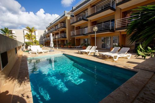 Seaside Apartment Pelican 105 with shared pool and garden view
