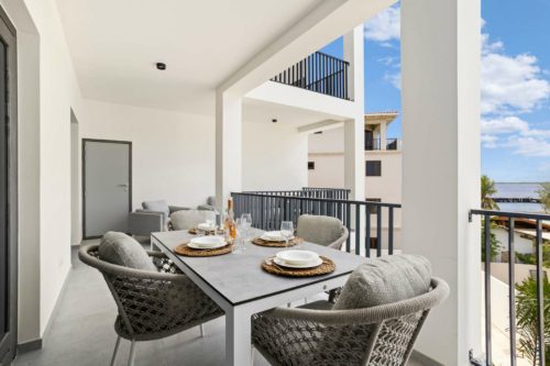 Bonaire Beach Apartments 12 with a mature palm garden and a lovely shared pool