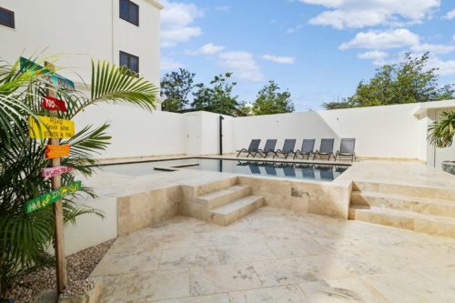 Bonaire Beach Apartment 2 with a palm garden, a refreshing shared pool and a private sitting area