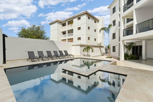 Bonaire Beach Apartments 3 with a mature palm garden and a lovely shared pool